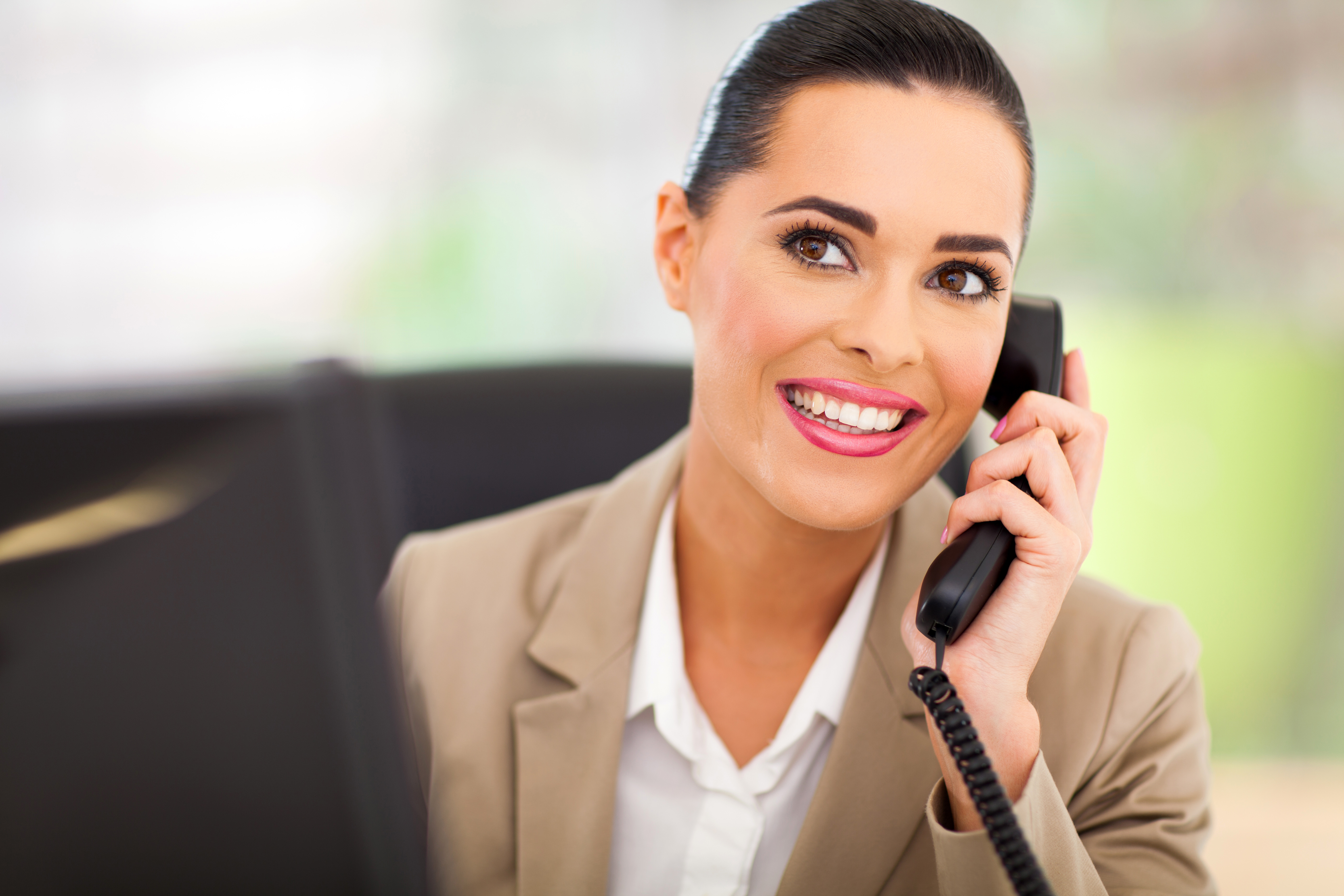 pretty switchboard operator answering telephone